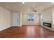 Comfortable living room featuring hardwood floors, lots of windows, and a fireplace at 152 Ambrose St, Erie, CO 80516