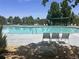 Community pool area featuring a pool, sun loungers, and well maintained landscaping at 152 Ambrose St, Erie, CO 80516