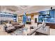 Spacious lounge area featuring modern design, modular seating, open layout, and contemporary decor at 4588 Thistle Dr, Brighton, CO 80601