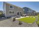 Lawn and patio area in backyard with grill and privacy fence at 417 S Ouray St, Aurora, CO 80017
