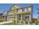 Charming two-story home with stone accents, a covered porch, and beautifully landscaped front yard at 417 S Ouray St, Aurora, CO 80017