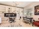 Bright home office featuring custom built-ins, an adjustable desk, and a comfortable ergonomic chair at 417 S Ouray St, Aurora, CO 80017