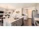 Open-concept kitchen with an island, stainless steel appliances, and seamless transition to the living spaces at 417 S Ouray St, Aurora, CO 80017