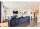 Bright and airy living room showcasing a fireplace, dark floors, and an open layout at 417 S Ouray St, Aurora, CO 80017