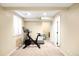 Finished basement is perfect as a workout area with a Peloton bike and a window at 20389 E Powers Pl, Centennial, CO 80015