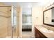 This bathroom features a glass shower with a view to the main bedroom and single sink vanity at 20389 E Powers Pl, Centennial, CO 80015