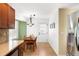 Bright kitchen dining area features a stainless steel refrigerator and table with seating for four at 20389 E Powers Pl, Centennial, CO 80015