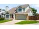 Charming exterior view of a two story home with a well kept lawn and attached two car garage at 20389 E Powers Pl, Centennial, CO 80015