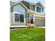 Close up front exterior of home with attractive green lawn at 20389 E Powers Pl, Centennial, CO 80015