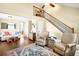 Open floor plan with hardwood floors and view into the adjacent living room at 20389 E Powers Pl, Centennial, CO 80015