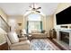 Bright living room with vaulted ceilings, large windows, fireplace, hardwood floors, and neutral decor at 20389 E Powers Pl, Centennial, CO 80015