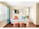 Bright living room with hardwood flooring, large windows, and cozy furniture at 20389 E Powers Pl, Centennial, CO 80015