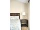 A well lit main bedroom features wood furniture and a soft neutral decor at 20389 E Powers Pl, Centennial, CO 80015