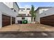 Three-car garage with dark brown doors at 1395 Bellaire St, Denver, CO 80220