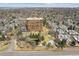 Stunning aerial view showcases the building's architecture and serene pond at 1900 E Girard Pl # 907, Englewood, CO 80113