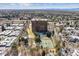 Expansive aerial view of property surrounded by lush greenery, offering serene views and community amenities at 1900 E Girard Pl # 907, Englewood, CO 80113
