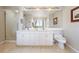 Bathroom featuring a double sink vanity with new hardware, and a shower with glass doors at 1900 E Girard Pl # 907, Englewood, CO 80113