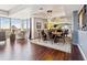 Elegant dining room with large windows, hardwood floors, and mirrored wall accents at 1900 E Girard Pl # 907, Englewood, CO 80113