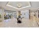 Welcoming foyer with a chandelier, tile flooring, and a view into the spacious living areas of the home at 1900 E Girard Pl # 907, Englewood, CO 80113