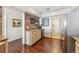 Kitchen area with marble countertops, brick wall accents, and modern appliances at 1900 E Girard Pl # 907, Englewood, CO 80113