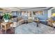 Spacious living room features a large sectional sofa, hardwood floors, and abundant natural light at 1900 E Girard Pl # 907, Englewood, CO 80113