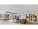 Common space showcasing large windows, built-in shelving, and neutral-toned furniture at 1900 E Girard Pl # 907, Englewood, CO 80113