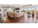 Bright living room featuring hardwood floors, floor-to-ceiling windows, and a cozy fireplace at 1900 E Girard Pl # 907, Englewood, CO 80113