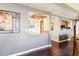 Stylish bar with wine glass rack and granite countertop, connecting to the modern kitchen at 1900 E Girard Pl # 907, Englewood, CO 80113