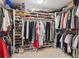 Spacious walk-in closet with ample shelving and hanging space for clothes and shoes in this home at 1900 E Girard Pl # 907, Englewood, CO 80113