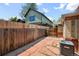 Spacious backyard with flagstone pavers and a wooden fence providing an outdoor space at 500 S Pennsylvania St # 520, Denver, CO 80209