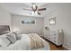Cozy bedroom with hardwood floors, ceiling fan, and a dresser for ample storage at 500 S Pennsylvania St # 520, Denver, CO 80209