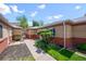 Well-maintained brick home with tidy landscaping and a paved walkway at 500 S Pennsylvania St # 520, Denver, CO 80209