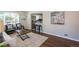 Bright living room with a decorative rug, stylish furniture, and a view into the modern kitchen at 500 S Pennsylvania St # 520, Denver, CO 80209