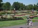 Park scenery with flower gardens and paths for walking and biking at 500 S Pennsylvania St # 520, Denver, CO 80209
