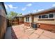 Private patio with flagstone pavers, enclosed by a wooden fence providing an outdoor living space at 500 S Pennsylvania St # 520, Denver, CO 80209