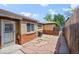 Private patio with flagstone pavers and access to the home, enclosed by a wooden fence at 500 S Pennsylvania St # 520, Denver, CO 80209
