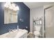 Modern bathroom featuring a vanity sink, toilet, walk-in shower with glass door and accent lighting at 9924 Silver Maple Way, Highlands Ranch, CO 80129