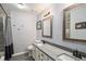 Bathroom featuring dual sinks, modern fixtures, tiled shower with glass door and new hexagonal tile floor at 9924 Silver Maple Way, Highlands Ranch, CO 80129