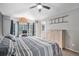 Bright bedroom features large windows, vaulted ceiling, and comfortable furnishings at 9924 Silver Maple Way, Highlands Ranch, CO 80129