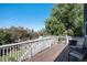 An outdoor deck offers scenic views, perfect for relaxing or entertaining, featuring outdoor seating and barbecue grill at 9924 Silver Maple Way, Highlands Ranch, CO 80129