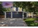 Charming two-story home featuring a three-car garage and a well-maintained front yard with mature tree at 9924 Silver Maple Way, Highlands Ranch, CO 80129