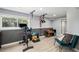 Home gym featuring exercise equipment and natural light from the window overlooking the yard at 9924 Silver Maple Way, Highlands Ranch, CO 80129