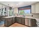 Modern kitchen featuring granite countertops, stainless steel appliances, and an open design at 9924 Silver Maple Way, Highlands Ranch, CO 80129