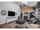Charming living room featuring fireplace, tv, vaulted ceilings, and comfortable seating at 9924 Silver Maple Way, Highlands Ranch, CO 80129
