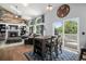 Comfortable living room with fireplace, vaulted ceilings, and open access to deck at 9924 Silver Maple Way, Highlands Ranch, CO 80129