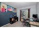 Office space with a two desks, black shelving, modern chair, and an eclectic decor at 9924 Silver Maple Way, Highlands Ranch, CO 80129