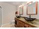 Bathroom features stylish dual vessel sinks, a unique countertop, and modern fixtures at 3600 S Pierce St # 5-101, Denver, CO 80235