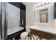 Chic bathroom featuring a clawfoot tub, modern vanity, and stylish tile work at 3600 S Pierce St # 5-101, Denver, CO 80235