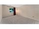 Spacious bedroom boasts neutral walls, carpet, and a window with curtains for privacy at 3600 S Pierce St # 5-101, Denver, CO 80235