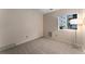 Bright bedroom featuring neutral walls, carpet, and natural light from the window at 3600 S Pierce St # 5-101, Denver, CO 80235